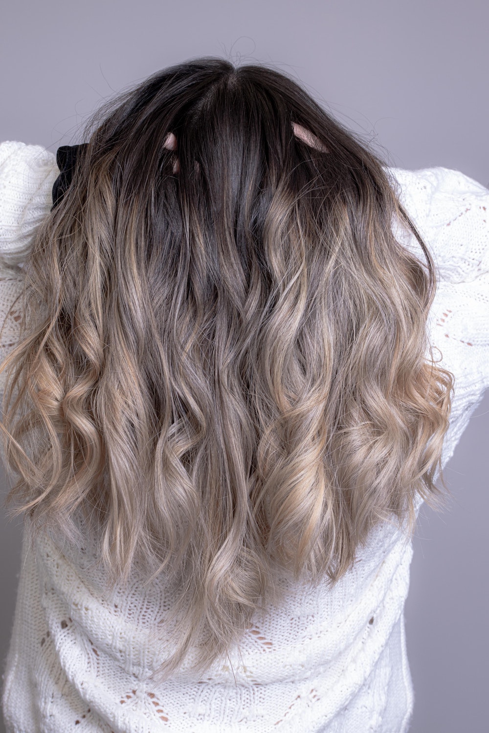 Soft Ombre - gradual fade from darker roots to lighter ends.